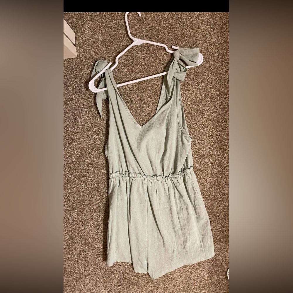 Pastel green romper. Never worn.